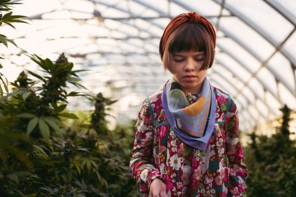 13 Industry Leaders Young person in a green house